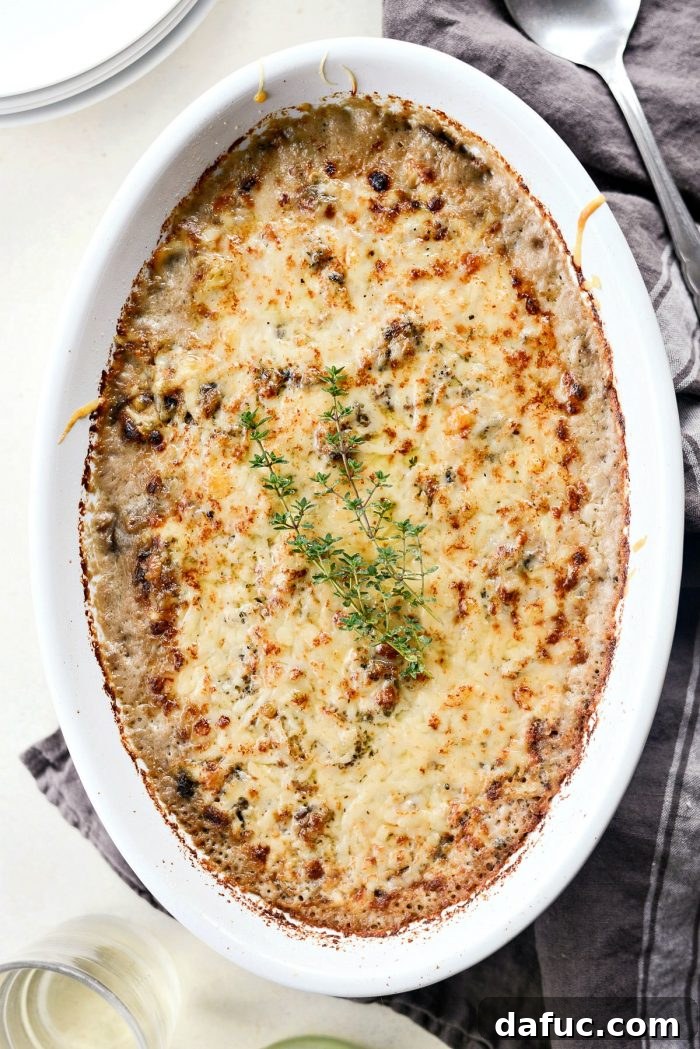 Hearty Mushroom Wild Rice Bake 13 The finished Mushroom Wild Rice Casserole, topped with golden, bubbly Gruyere cheese, fresh out of the oven.