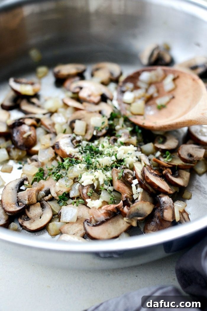 Hearty Mushroom Wild Rice Bake 7 Sliced cremini mushrooms added to the sautéed onions in a skillet.