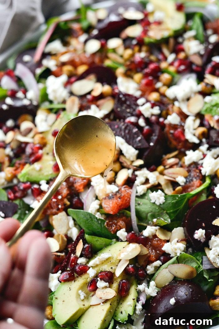 Adding fresh avocado slices to the Roasted Grapefruit Beet Salad.