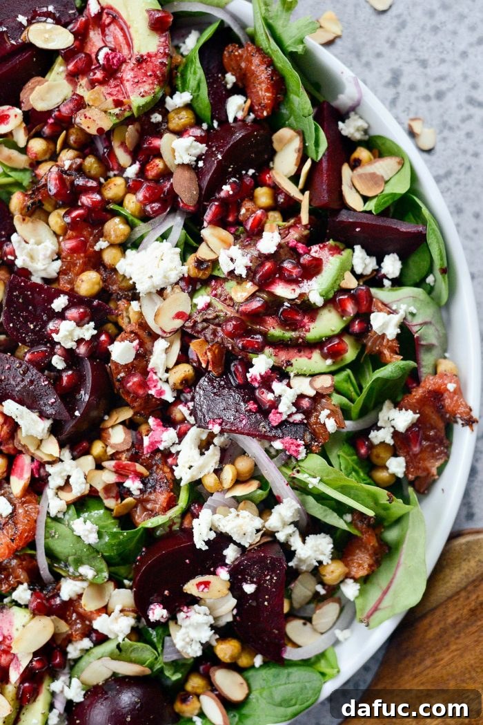 Drizzling the homemade grapefruit vinaigrette over the colorful Roasted Grapefruit Beet Salad.