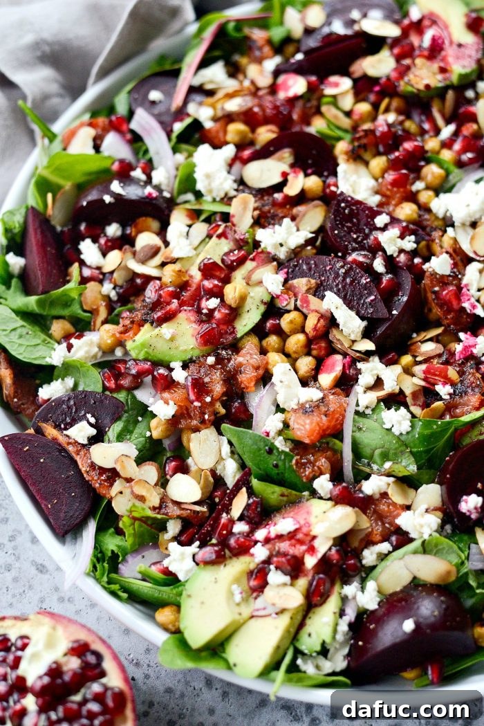 A close-up of the vibrant, colorful Roasted Grapefruit Beet Salad, highlighting its fresh ingredients.