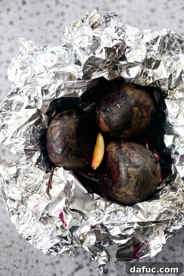 Freshly roasted beets, ready to be peeled and added to the salad.