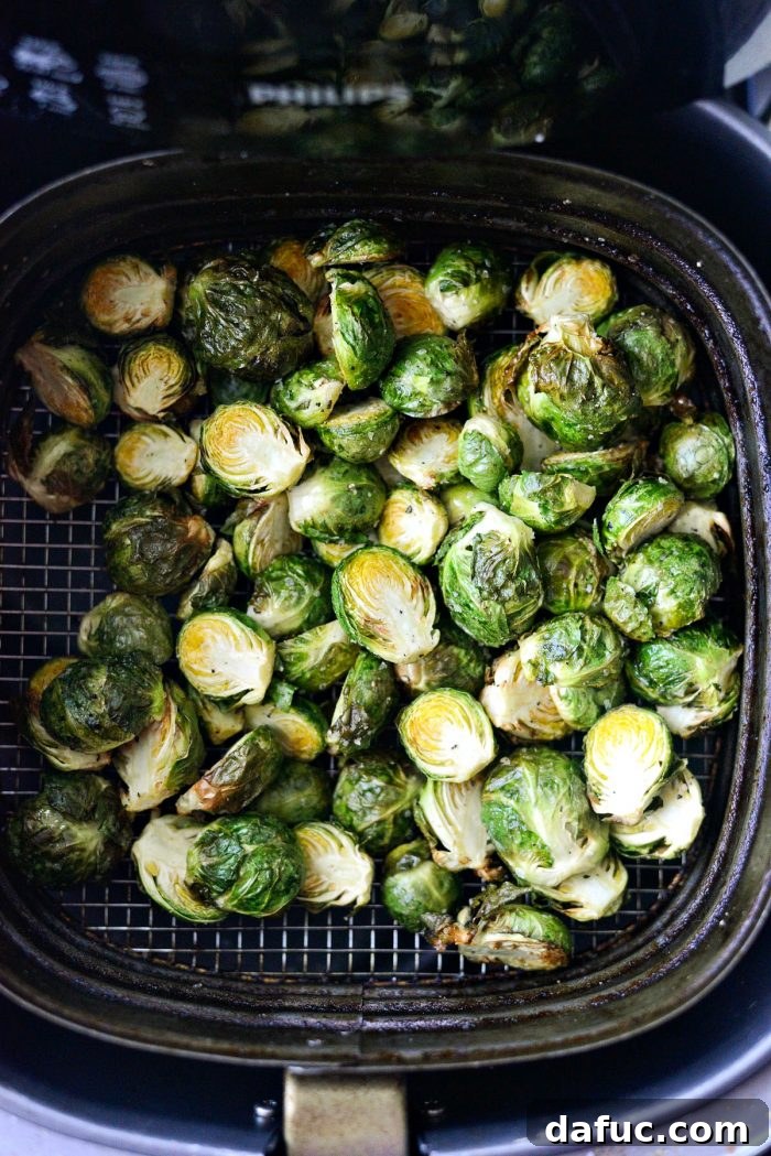Brussels sprouts getting crispy in the air fryer.