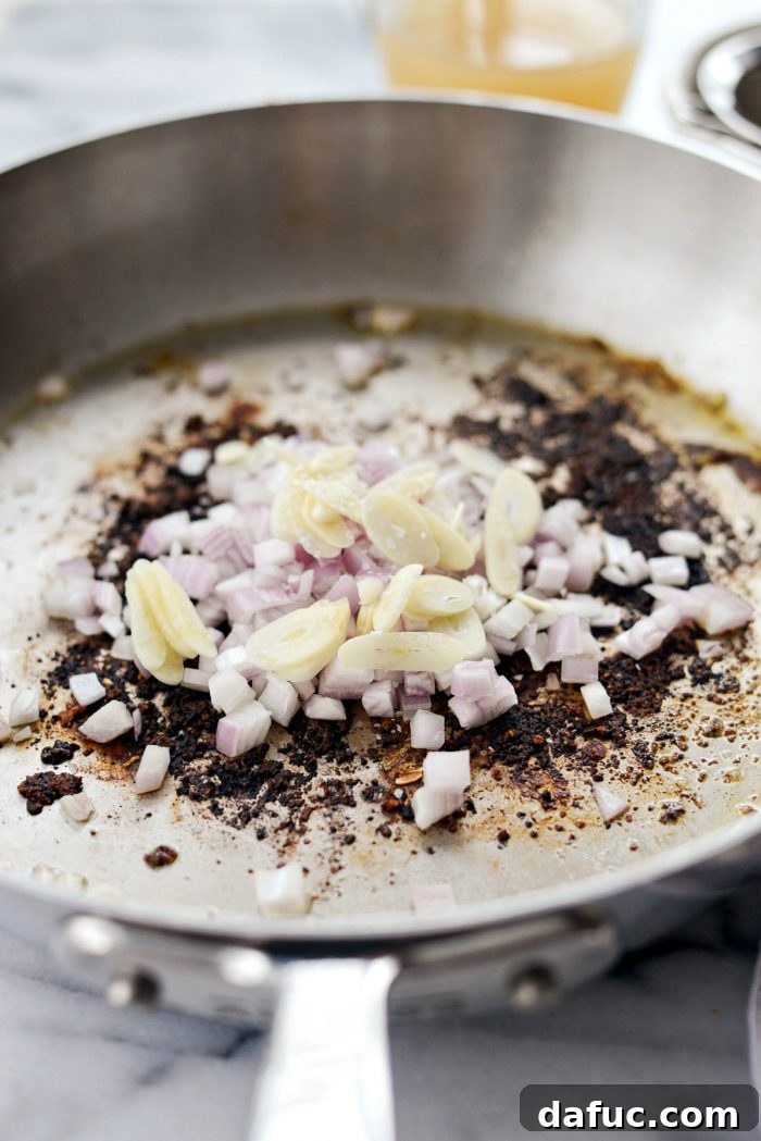 Bright & Healthy Chicken Piccata 6 Searing chicken in a hot skillet for piccata