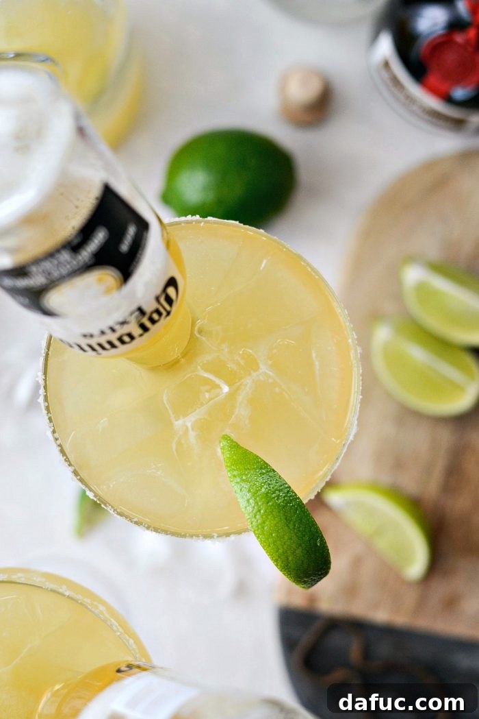 Signature Beergarita 13 A Beergarita cocktail complete with an inverted Coronita, showcasing its unique and festive presentation.