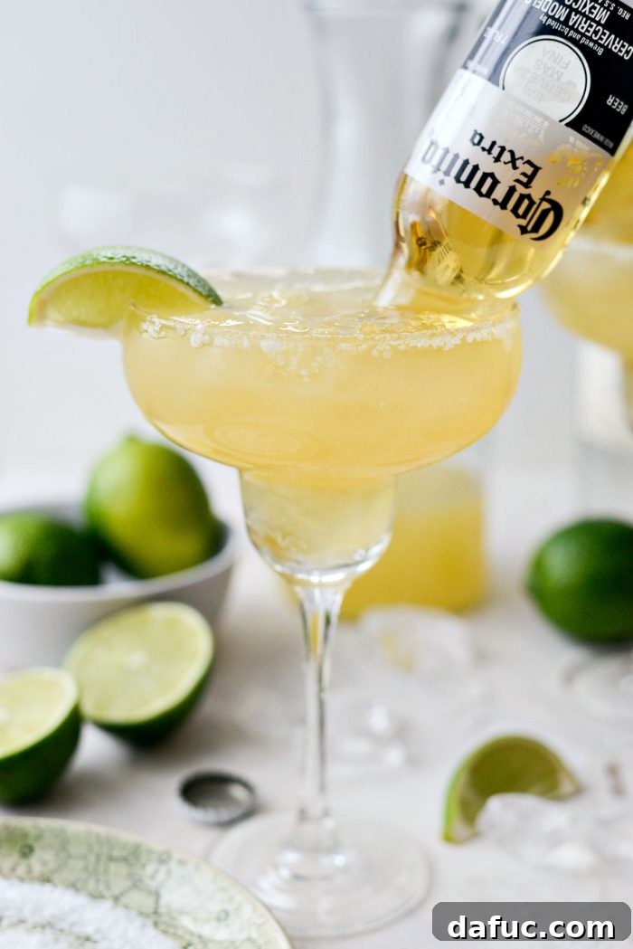 Signature Beergarita 14 A beautifully presented Beergarita, garnished with a lime wedge, ready to be enjoyed.
