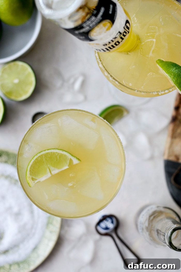 Signature Beergarita 17 A vibrant Beergarita cocktail with a festive straw, ready for a celebration.