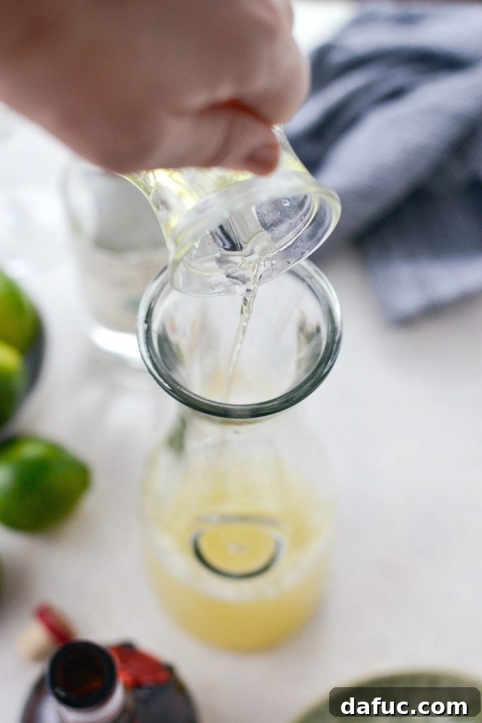 Signature Beergarita 6 Freshly squeezed lime juice in a glass, a key ingredient for a vibrant Beergarita.