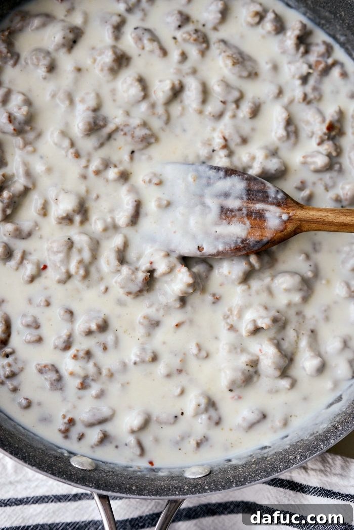 Close-up of the rich, thick, and creamy texture of the ready-to-serve turkey sausage breakfast gravy.