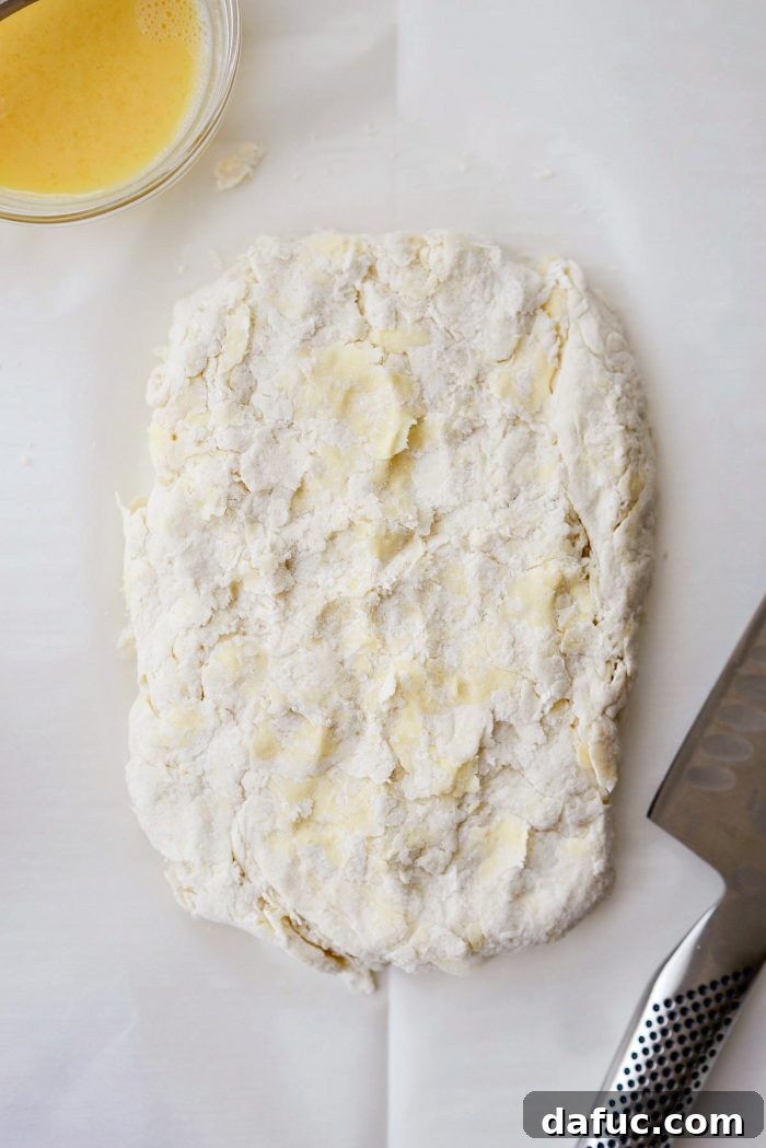 Cloud-Like Greek Yogurt Biscuits 10 Mixing the Greek yogurt into the dough with a rubber spatula, forming a shaggy dough.
