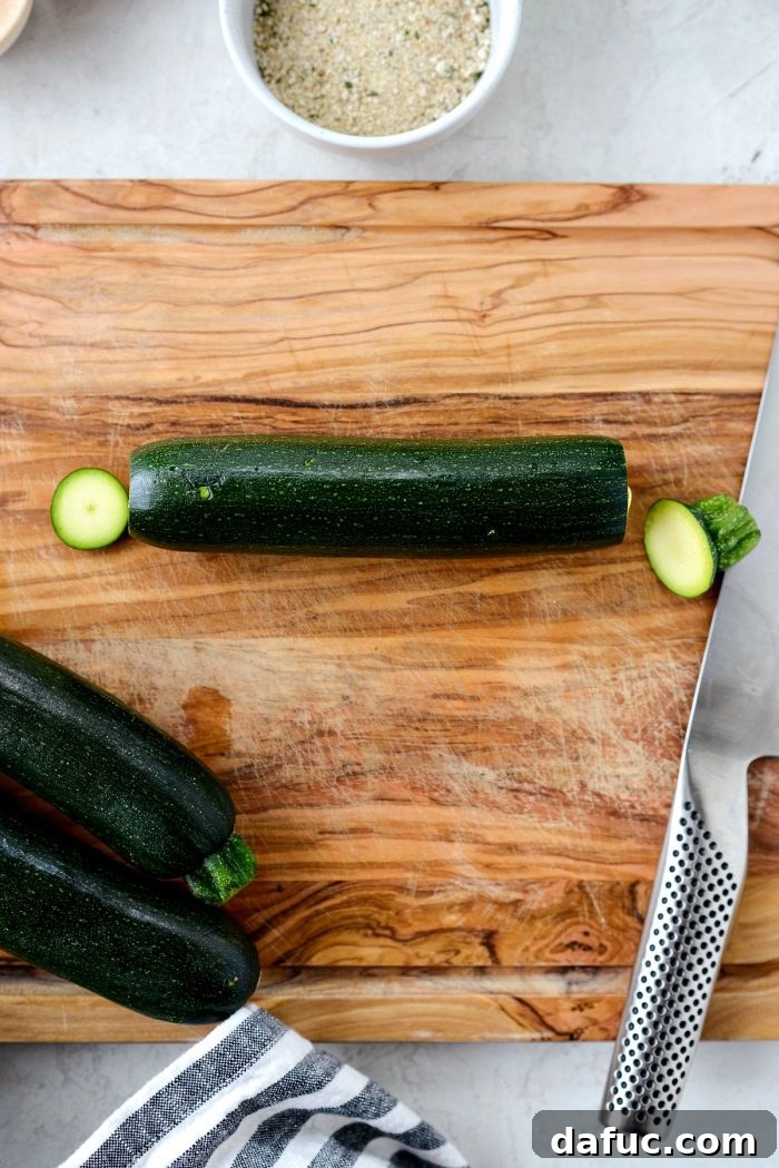 Crispy Air-Fried Zucchini Sticks 4 Ends trimmed off fresh zucchini for air fryer fries.