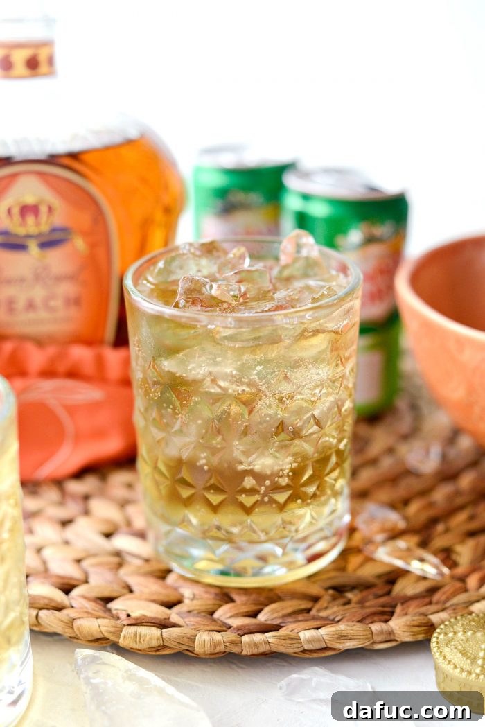 Lewis Peach Ginger Whiskey Infusion 9 An icy cold Lewis' Ginger Peach Whiskey Cocktail ready to be enjoyed.