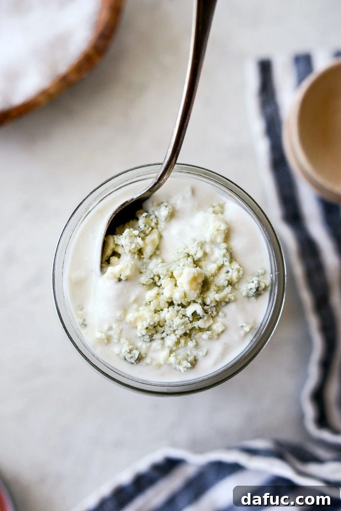 Tangy Greek Yogurt Blue Cheese Dressing 2 Creamy Greek Yogurt Blue Cheese Dressing in a glass jar, ready to be served
