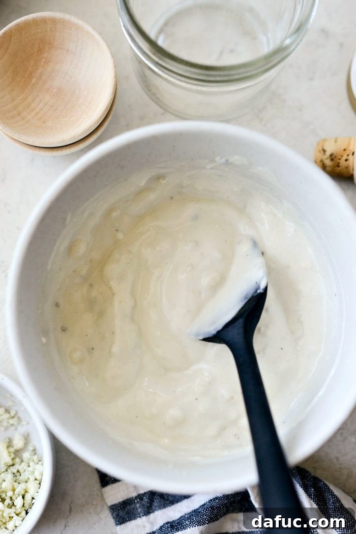 Tangy Greek Yogurt Blue Cheese Dressing 6 All ingredients mixed together in a bowl to form the salad dressing