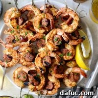 Finished Cajun Shrimp and Andouille Skewers on a platter.