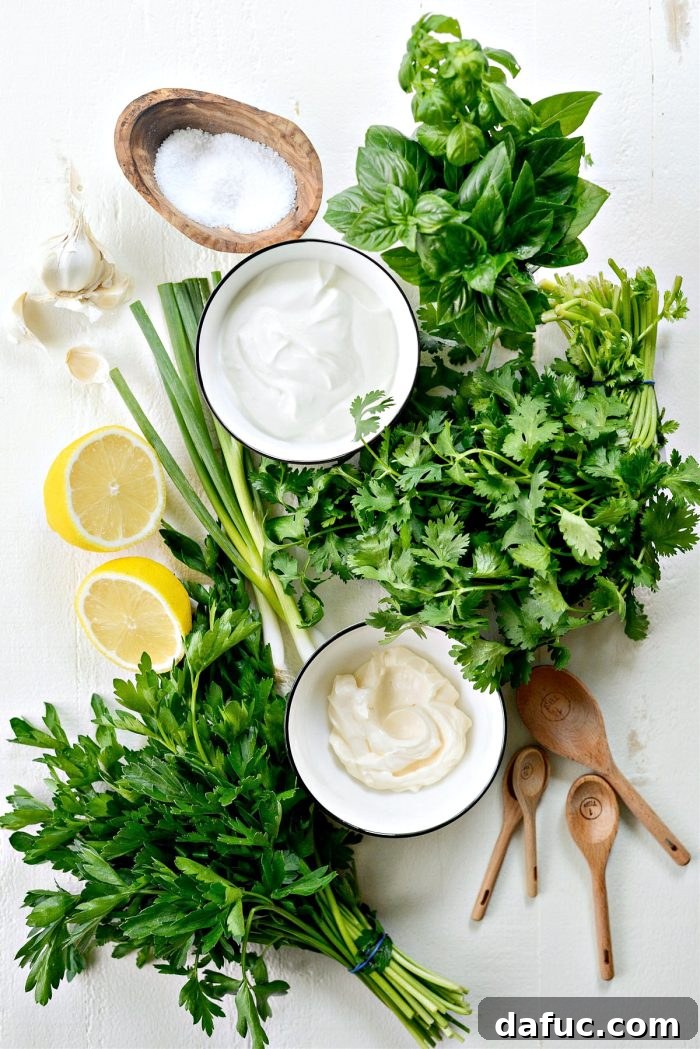 Fresh ingredients laid out for Greek Yogurt Green Goddess Salad Dressing