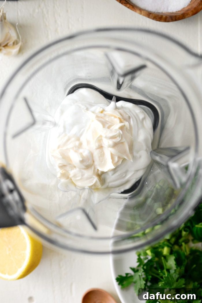 Greek yogurt and mayonnaise in a blender ready for blending