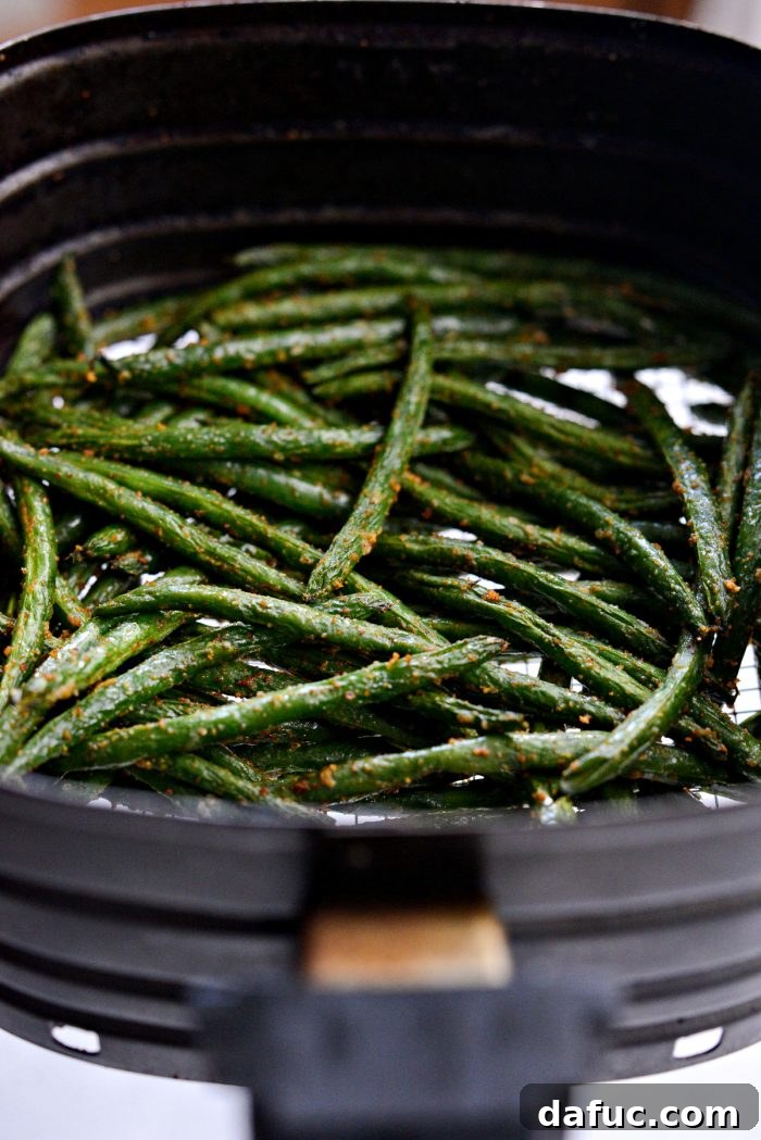 Crispy Air Fryer Green Beans 12 Air fried green beans, golden and tender-crisp, in the air fryer basket