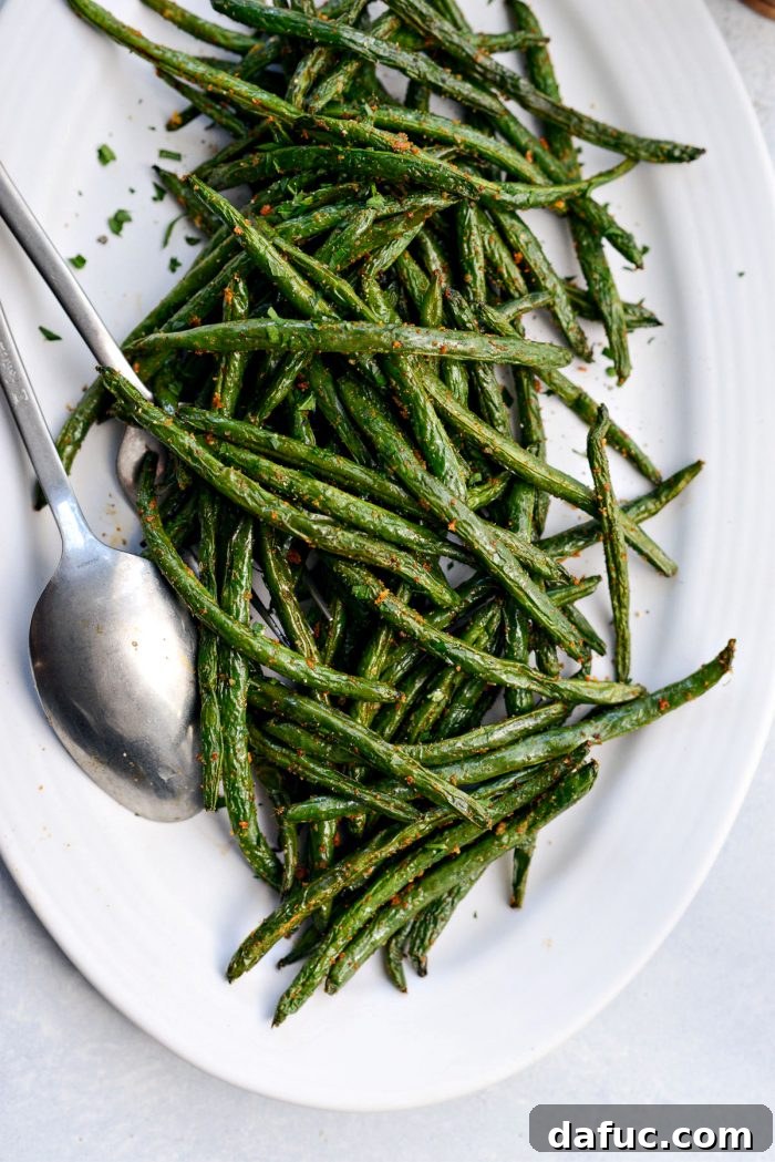 Crispy Air Fryer Green Beans 15 A large serving bowl filled with crisp and tender air-fried green beans