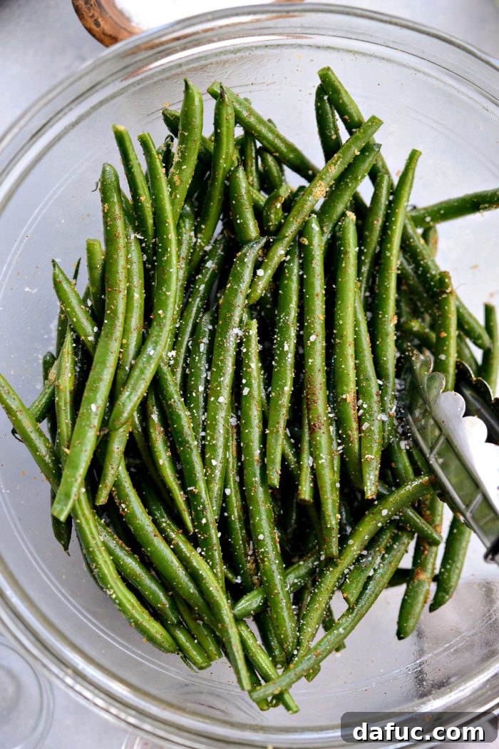 Crispy Air Fryer Green Beans 9 Green beans seasoned with kosher salt, ready for a final toss
