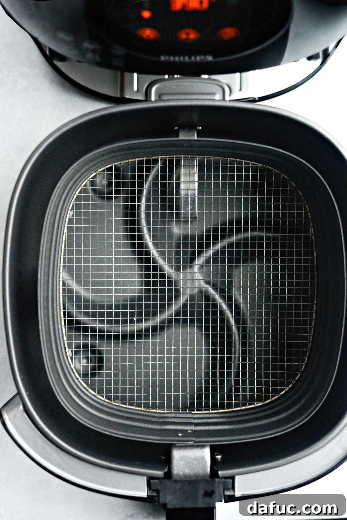 Crispy Air Fryer Green Beans 10 Air fryer basket preheating, ready for green beans
