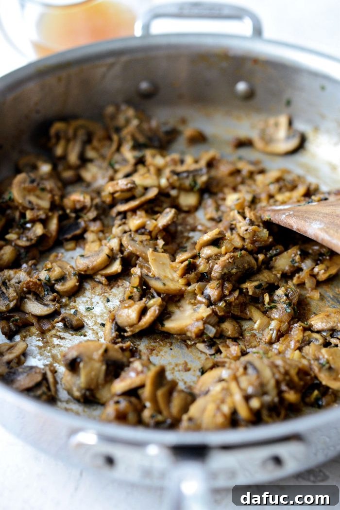The flour has been cooked into the sautéed vegetables, forming a light roux in the skillet.