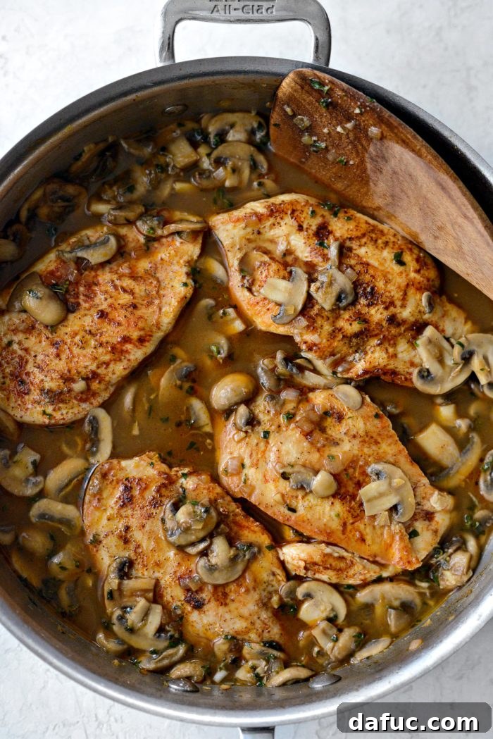 Cooked chicken breasts are returned to the skillet and generously smothered with the rich mushroom Marsala sauce.