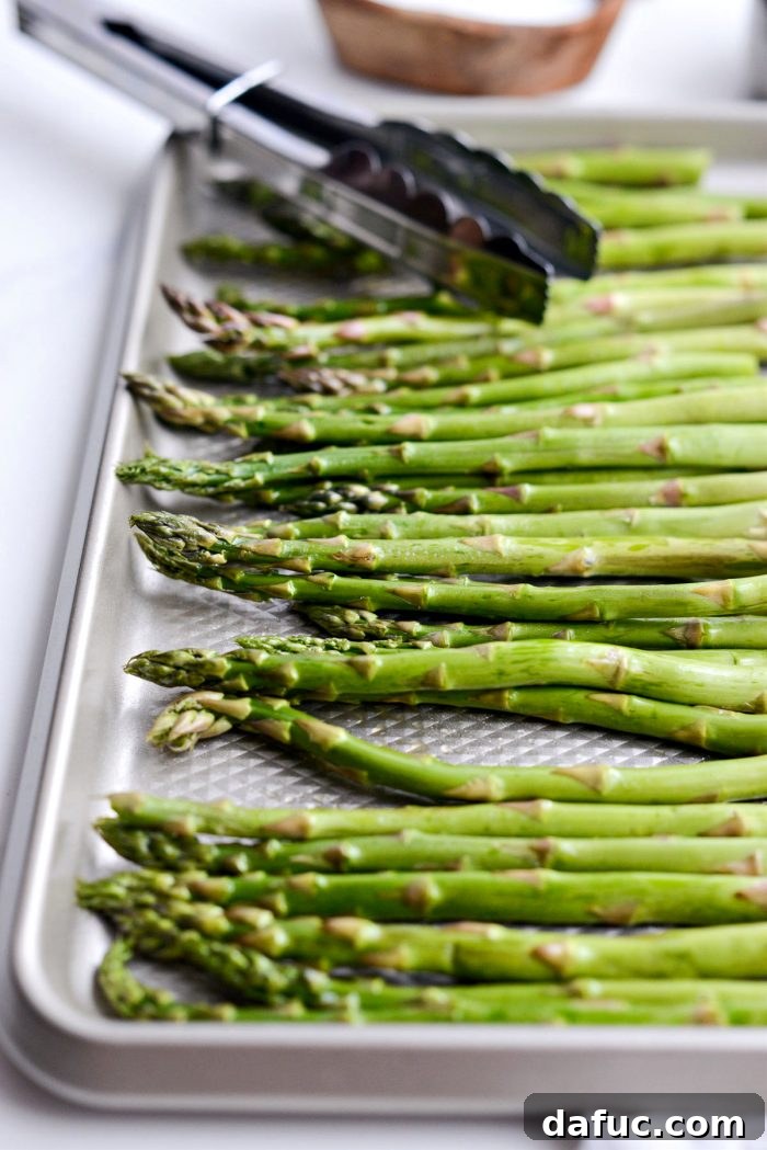 Crispy Air Fried Balsamic Asparagus 5 Trimmed asparagus in a shallow pan coated in olive oil