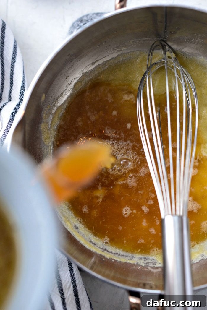 Delicious Gravy, Made in Advance 19 pour in a little of the turkey broth - Adding turkey broth to the roux