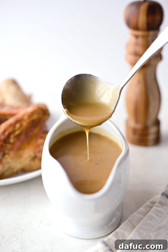 Delicious Gravy, Made in Advance 25 Make Ahead Turkey Gravy served in a gravy boat