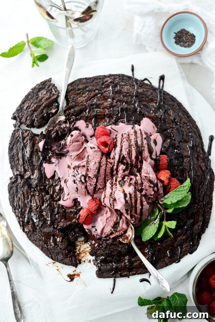Giant Double Dark Chocolate Share Cookie with ice cream and chocolate syrup