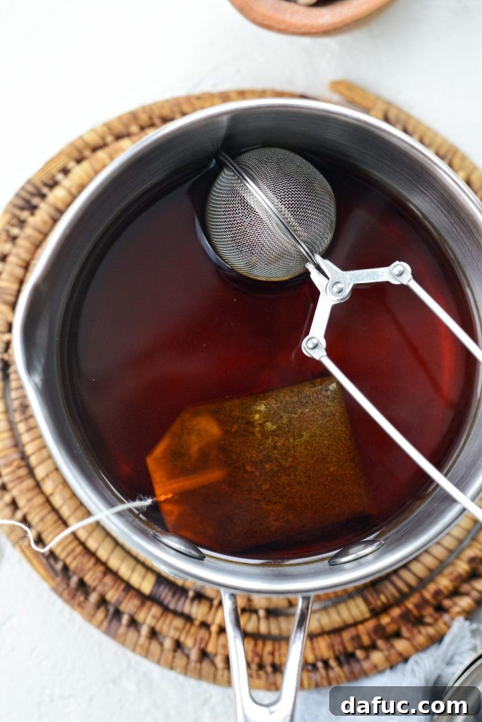 Steeped Earl Grey tea and lavender in a saucepan, signaling it's ready for the next step.