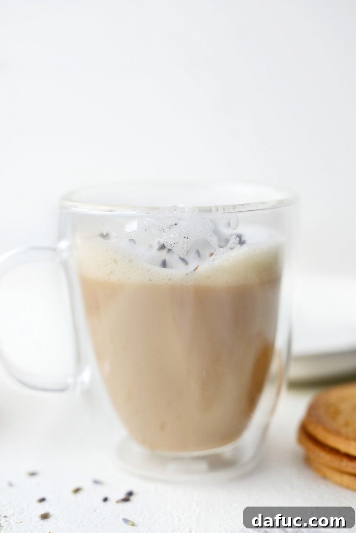 A close-up of a London Fog Tea Latte, emphasizing its inviting and warm aesthetic.