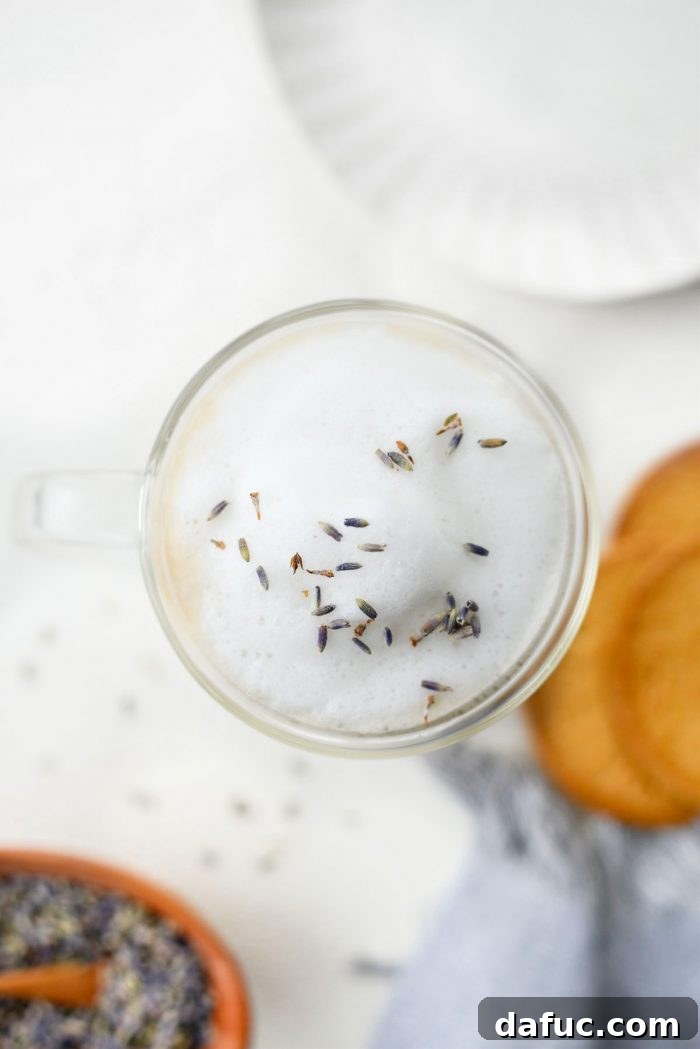 A close-up shot of an Earl Grey tea bag and loose culinary lavender, highlighting the key ingredients for a London Fog Tea Latte.