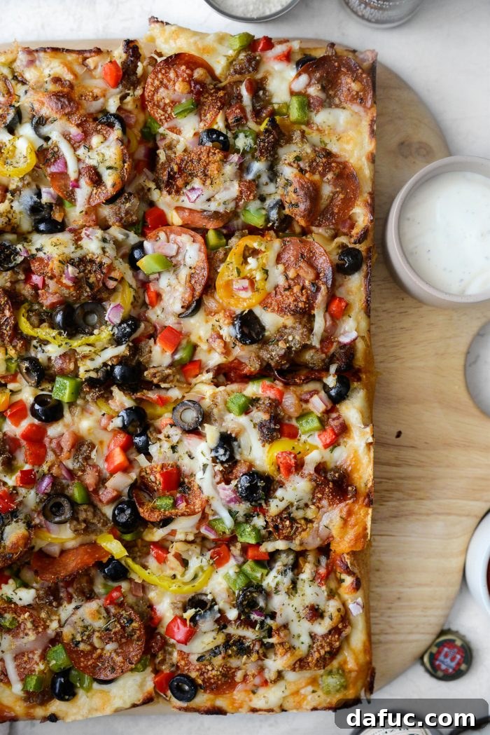 Ultimate Focaccia Pizza 2 Focaccia Pizza Supreme's golden-brown crust and plentiful toppings.