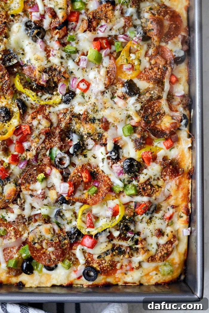 Ultimate Focaccia Pizza 27 Close-up of the Focaccia Pizza Supreme, showcasing its rich toppings and melted cheese.