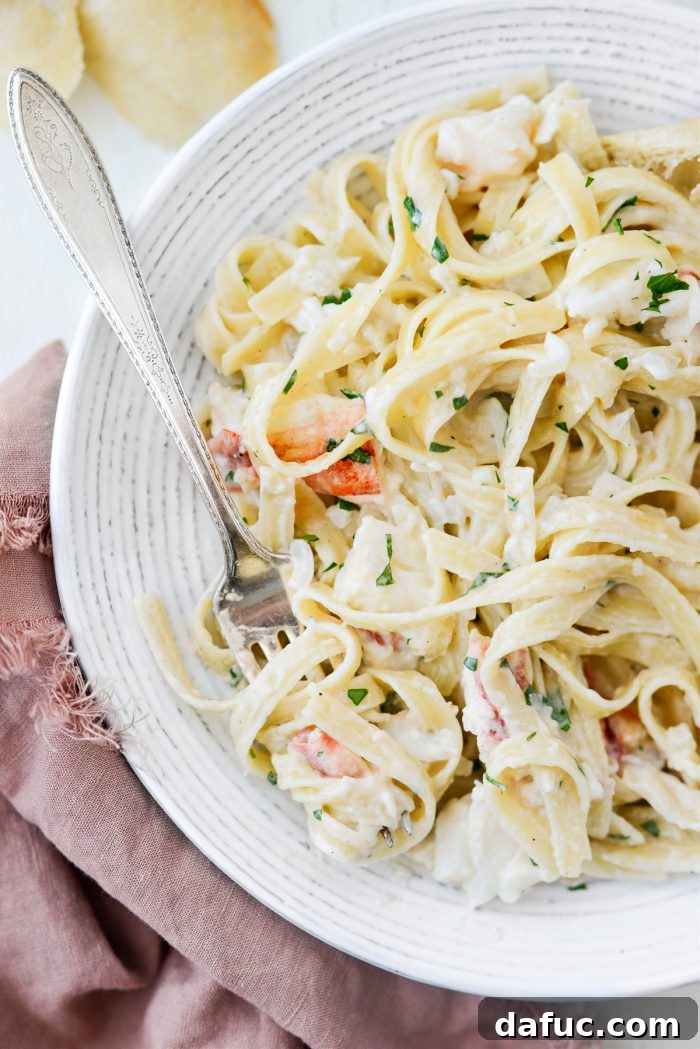 close up of fork with Garlicky Lobster Fettuccine
