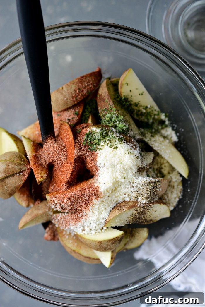 Seasoning Potato Wedges with All-Purpose Seasoning, Pecorino, Parsley, and Pepper