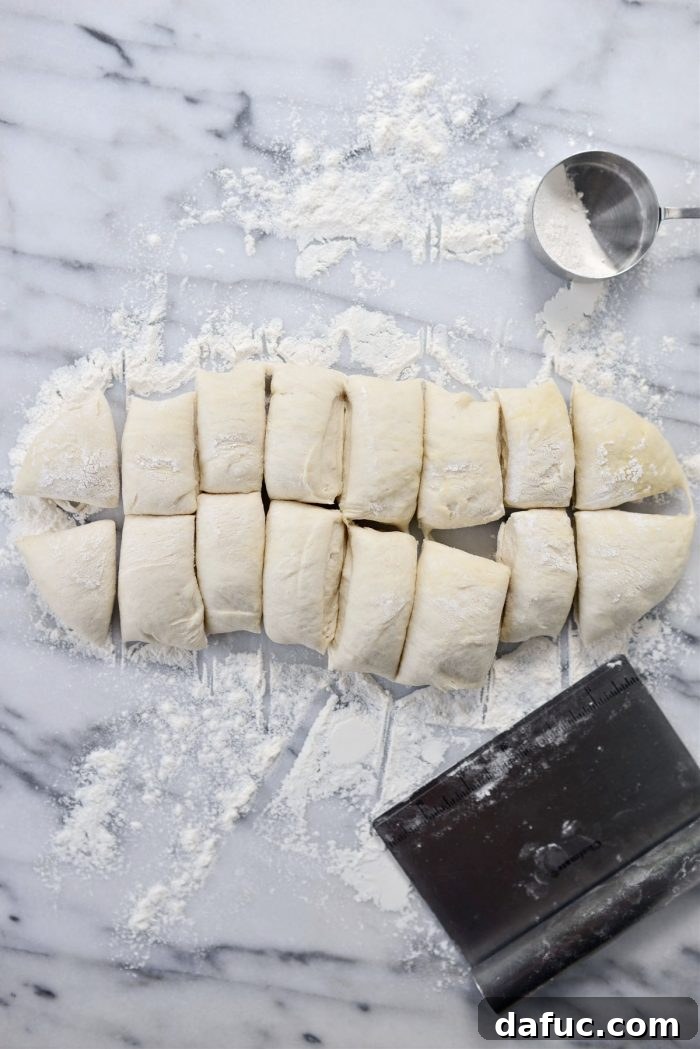 Bite-Sized Pita Pockets 15 Pita dough precisely divided into 16 equal pieces, ready for shaping