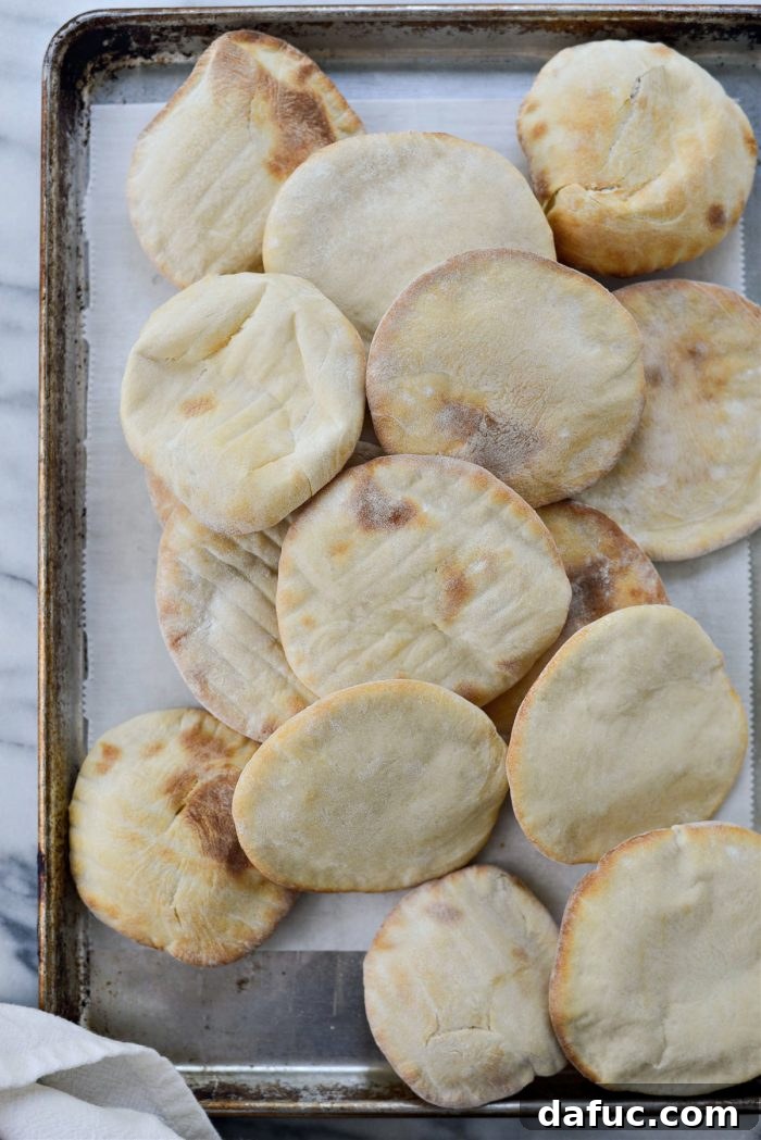 Bite-Sized Pita Pockets 21 Warm homemade mini pita bread covered with a towel to lock in softness
