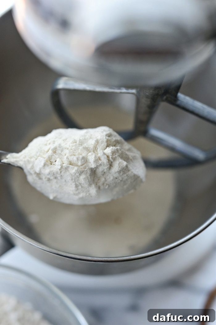 Bite-Sized Pita Pockets 7 Gradually adding bread flour to the yeast and water mixture in a mixer
