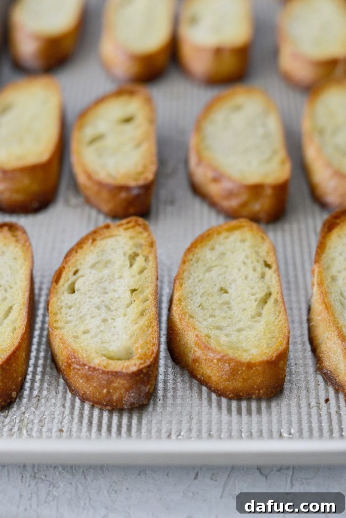 Perfectly toasted French baguette slices, golden brown and crispy.