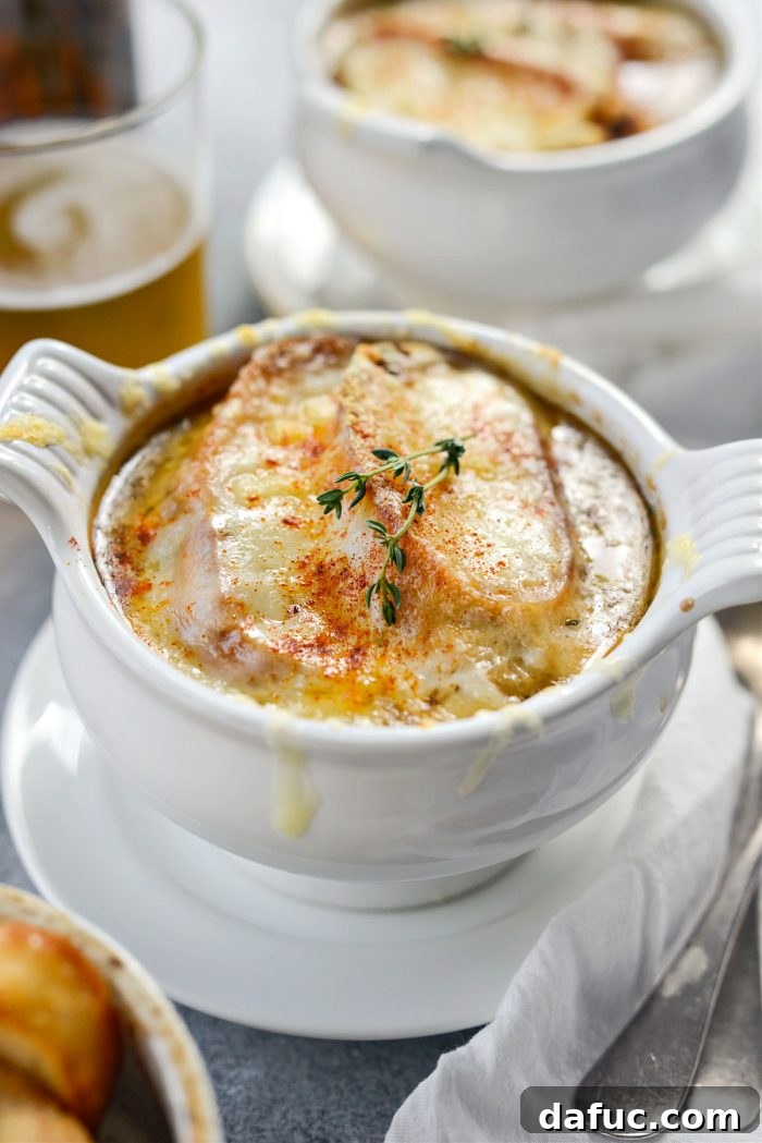 A perfectly broiled bowl of Smoky Beer French Onion Soup, cheese melted and golden.