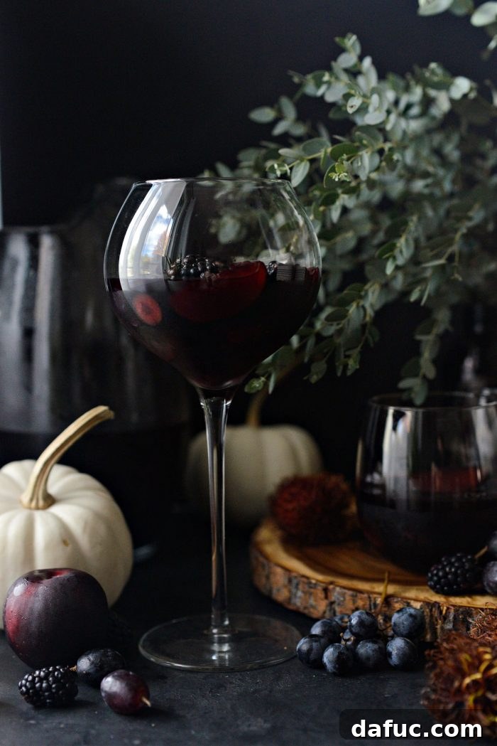 Black Magic Sangria poured into glasses with fruit