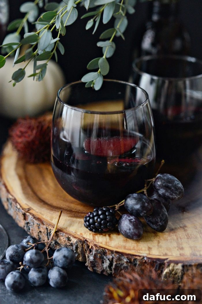 Black Magic Sangria in a glass, ready to be enjoyed