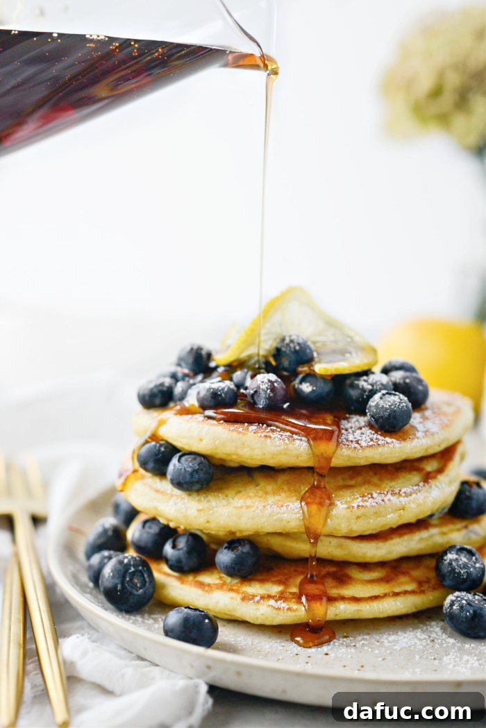 Bright Lemon Blueberry Pancakes 16 Lemon Blueberry Pancakes topped with butter and blueberries