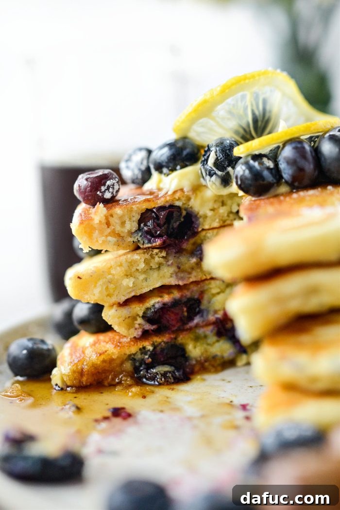 Bright Lemon Blueberry Pancakes 20 Lemon Blueberry Pancakes with syrup drip