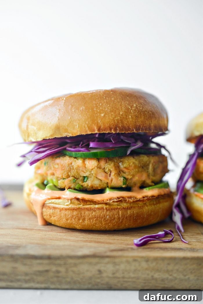 The Story of 2021 15 Hearty Spicy Salmon Burgers with avocado and slaw on brioche buns