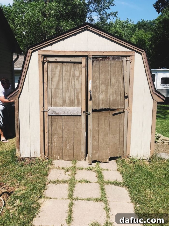 The Story of 2021 36 Before photo of an old, weathered backyard shed