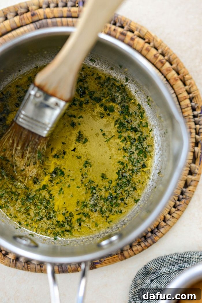 Adding last of the butter, parsley, garlic powder with a pinch of salt for topping